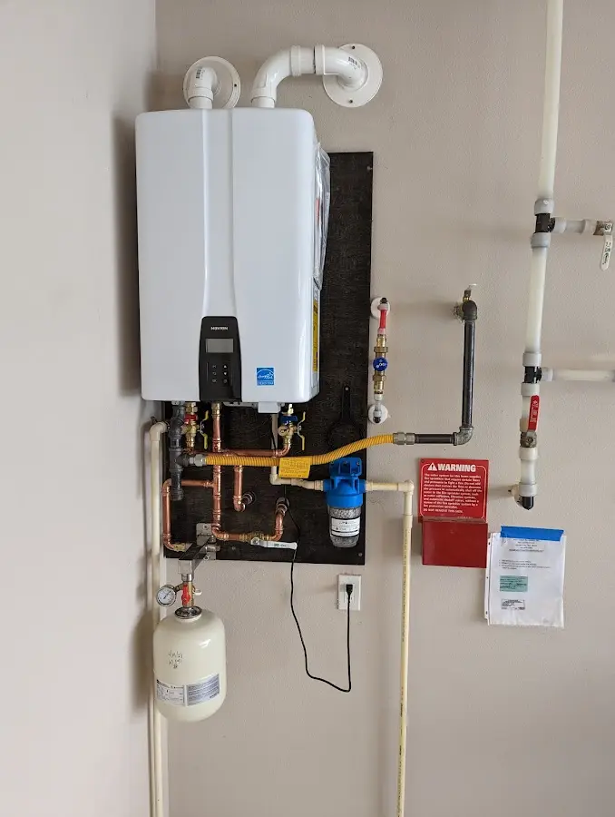 Professional plumber installing copper piping in a Fort Pierce North home